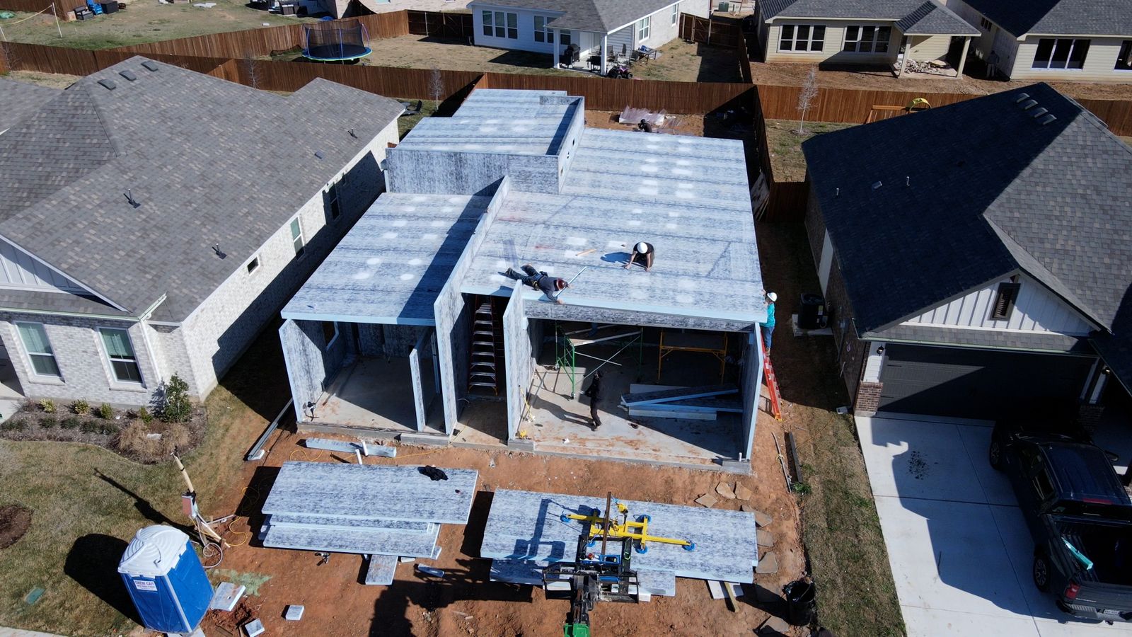 Aerial view of a modular panel home shell under construction